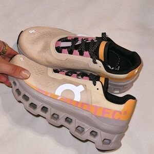 On Running Cream and Pink Sneakers with CloudTec Cushioning